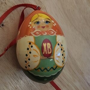 Festive Matryoshka Doll Ornament with Red Ribbon